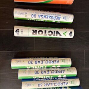 Brand new, top-of-the-line tournament-grade badminton shuttlecocks, unopened.
